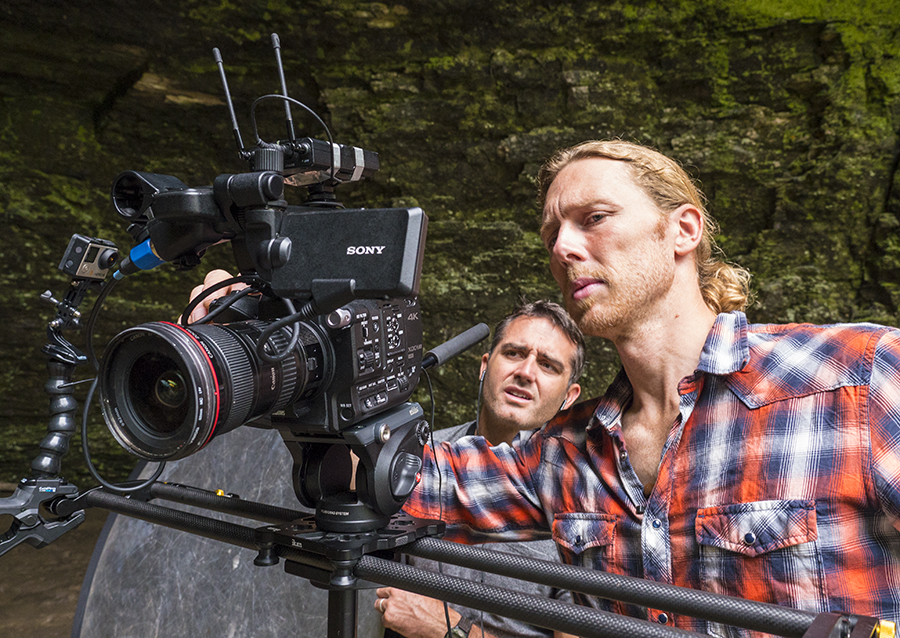 Jonas Stenstrom adjusts camera as Rob Nelson looks on